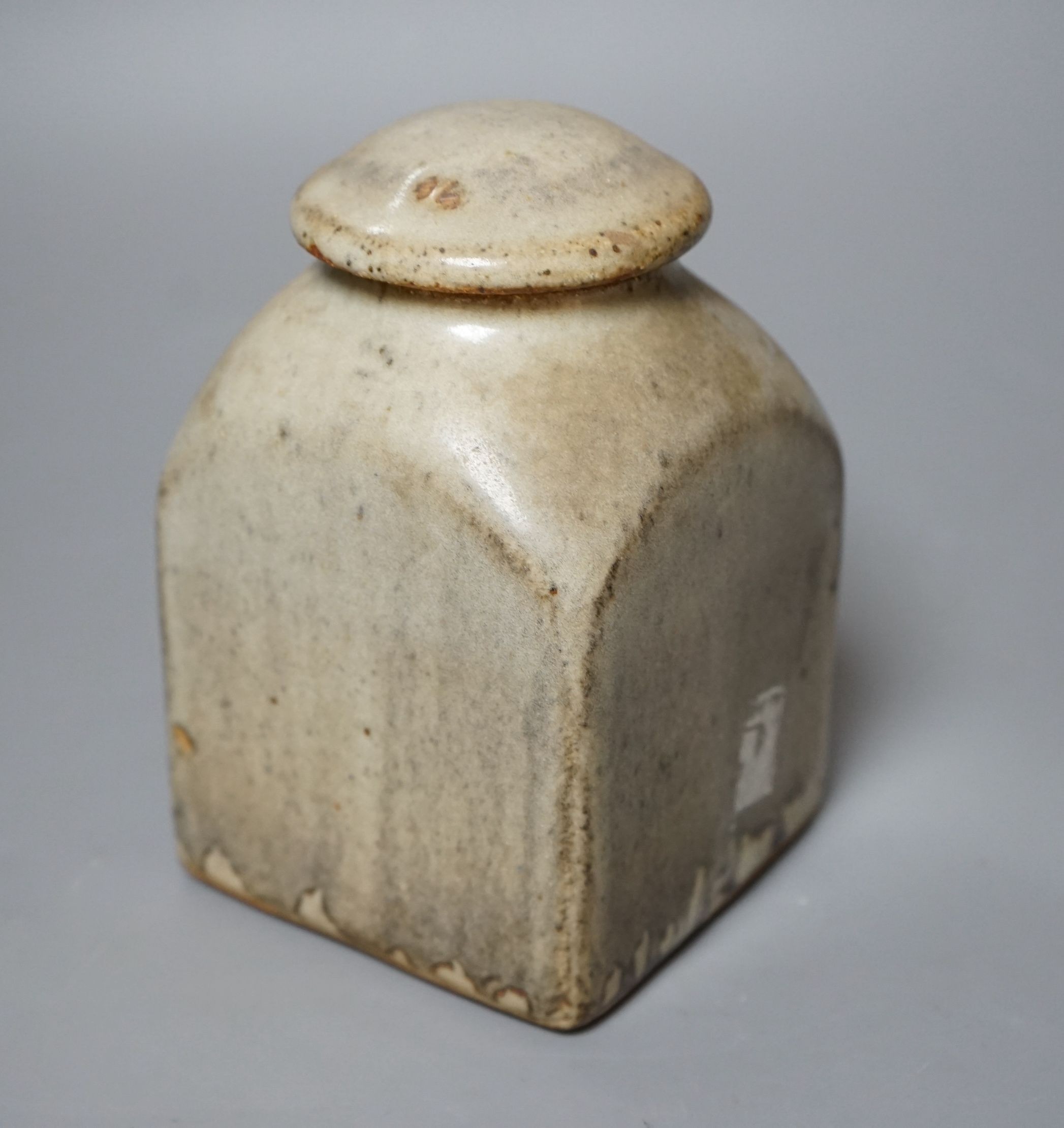 Bernard Leach for St Ives pottery, a mushroom-grey glazed square sided jar and cover, impressed marks to base, 16.5cm tall